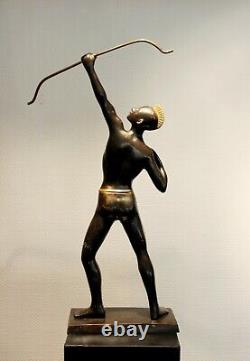 Old brass archer figure