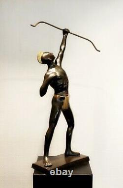 Old brass archer figure