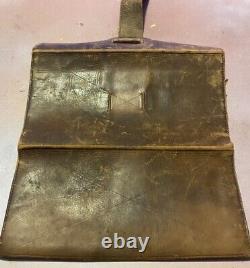 Old leather wallet with content