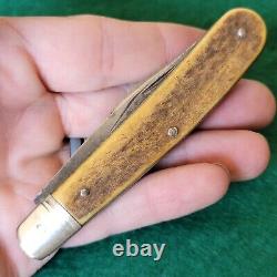 Ancien couteau de poche pliant à grosse tête de cerf en os d'époque et d'antiquité