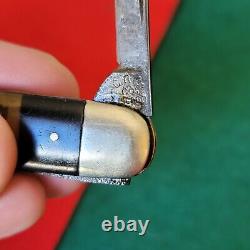 Ancienne règle d'or risquée pour dames égales, image de stylo de poche couteau de collection antique.